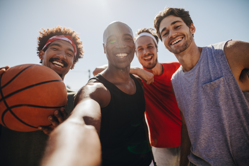 Men Playing Basketball Posing for Photo